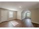 Spacious bonus room with wood-look flooring and natural light offers versatility for various activities at 105 Kentwood Springs Dr, Hampton, GA 30228