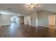 Bonus room includes a ceiling fan, wood-look floors, and bathroom access for a convenient and modern design at 105 Kentwood Springs Dr, Hampton, GA 30228
