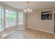 Dining area with large windows providing ample natural light and backyard views at 105 Kentwood Springs Dr, Hampton, GA 30228