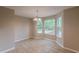 Bright dining area with three large windows and an elegant chandelier at 105 Kentwood Springs Dr, Hampton, GA 30228