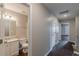 A pristine hallway leading to a well-appointed bathroom and bedroom offers seamless transition and flow at 105 Kentwood Springs Dr, Hampton, GA 30228
