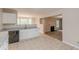 Open-concept kitchen featuring granite countertops and white cabinetry at 105 Kentwood Springs Dr, Hampton, GA 30228