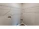 A clean laundry room with utility connections and wire shelving offers convenience and organization at 105 Kentwood Springs Dr, Hampton, GA 30228
