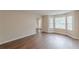 Bright living room with hardwood floors and large windows offering plenty of natural light at 105 Kentwood Springs Dr, Hampton, GA 30228