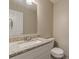 Powder room with granite counters and white vanity at 105 Kentwood Springs Dr, Hampton, GA 30228