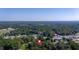 Birds eye view showing lush green trees in the surrounding neighborhood at 116 Tallapoosa St, Temple, GA 30179