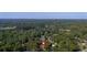 Aerial view of the property surrounded by lush greenery, showcasing a peaceful and private setting at 116 Tallapoosa St, Temple, GA 30179