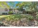 Sprawling backyard with lush green lawn, brick pavers, and privacy fence at 116 Tallapoosa St, Temple, GA 30179