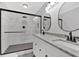 Modern bathroom features a glass shower, dual vanity, tile floors, and black fixtures at 116 Tallapoosa St, Temple, GA 30179