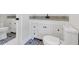 Well-lit bathroom with granite countertops, dual sinks, decorative tile, and modern fixtures at 116 Tallapoosa St, Temple, GA 30179
