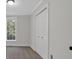 Cozy bedroom features neutral paint, carpet floors, and a large closet at 116 Tallapoosa St, Temple, GA 30179