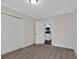 Cozy bedroom with carpet, neutral paint, and access to kitchen through open doorway at 116 Tallapoosa St, Temple, GA 30179
