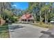 This home has a long driveway leading to the cute house with the red roof at 116 Tallapoosa St, Temple, GA 30179