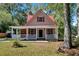 Charming home features a welcoming front porch and inviting red shutters at 116 Tallapoosa St, Temple, GA 30179