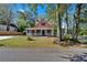 Lovely home showcases a welcoming front porch and lush green lawn at 116 Tallapoosa St, Temple, GA 30179