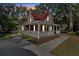 Charming home with a welcoming front porch and a red roof at 116 Tallapoosa St, Temple, GA 30179