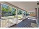 Inviting front porch with a wooden deck and white railing, offering a welcoming outdoor space at 116 Tallapoosa St, Temple, GA 30179