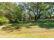 Lush front yard with mature trees providing shade and character to the property at 116 Tallapoosa St, Temple, GA 30179