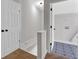 Hallway with carpet floors, wainscotting, and access to closet and laundry room at 116 Tallapoosa St, Temple, GA 30179