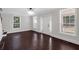 A spacious living room featuring large windows and hardwood floors at 116 Tallapoosa St, Temple, GA 30179