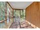 Relax in this screened in porch with wood flooring at 116 Tallapoosa St, Temple, GA 30179