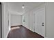 Sun Room with wainscotting, tile flooring and a white front door at 116 Tallapoosa St, Temple, GA 30179