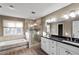 Primary bathroom featuring soaking tub, shower and dual sinks at 1190 Midland Way, Lawrenceville, GA 30043