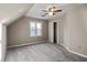 Bedroom featuring vaulted ceilings, a ceiling fan, a window and carpeted floors at 1190 Midland Way, Lawrenceville, GA 30043