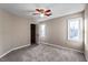 Bedroom featuring neutral walls, carpet floors, and a window at 1190 Midland Way, Lawrenceville, GA 30043