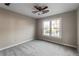 Bedroom featuring a ceiling fan and a double window providing natural light at 1190 Midland Way, Lawrenceville, GA 30043