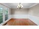 Dining room featuring hardwood floors, neutral wall paint, and a chandelier at 1190 Midland Way, Lawrenceville, GA 30043