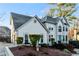 Charming two-story home with a well-manicured lawn, garden, and blue front door at 1190 Midland Way, Lawrenceville, GA 30043