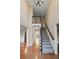 Spacious home foyer featuring hardwood floors, stairs to the upper level, and natural light at 1190 Midland Way, Lawrenceville, GA 30043