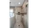 Modern walk-in shower with tile surround and niche at 1190 Midland Way, Lawrenceville, GA 30043