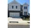 Charming two-story home with a two-car garage, stone accents, and a well-manicured lawn at 270 Lakeside Pl, Canton, GA 30114