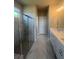 Modern bathroom with a glass shower, marble tile, and a double sink vanity at 270 Lakeside Pl, Canton, GA 30114