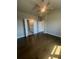 Spacious bedroom with hardwood floors, a ceiling fan, and an en suite bathroom at 270 Lakeside Pl, Canton, GA 30114