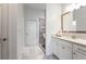 Bright, neutral bathroom featuring a white vanity with marble countertop and modern fixtures, plus a glass-enclosed shower at 341 Little Pine Ln, Woodstock, GA 30188