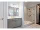 Modern bathroom boasts a glass-enclosed shower, sleek vanity, and neutral tones at 341 Little Pine Ln, Woodstock, GA 30188