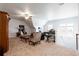 Spacious bonus room featuring a ceiling fan, seating area, and ample natural light at 341 Little Pine Ln, Woodstock, GA 30188