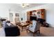 Bonus room showcasing a large entertainment center, ceiling fan, and comfortable seating at 341 Little Pine Ln, Woodstock, GA 30188