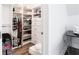 Walk-in closet with built-in shelving and organization solutions for optimal storage at 341 Little Pine Ln, Woodstock, GA 30188