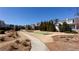 Picturesque community grounds with walking paths, gardens, and well-maintained lawns under a clear blue sky at 341 Little Pine Ln, Woodstock, GA 30188