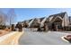 Gated community entrance with well-maintained landscaping and attractive brick and siding homes at 341 Little Pine Ln, Woodstock, GA 30188