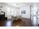 Bright dining room featuring hardwood floors, modern lighting, and a table with seating for eight at 341 Little Pine Ln, Woodstock, GA 30188