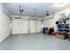 Spacious two-car garage with ample storage space and epoxy-coated flooring at 341 Little Pine Ln, Woodstock, GA 30188
