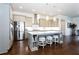 Modern kitchen with stainless steel appliances, center island with seating, and gray cabinets at 341 Little Pine Ln, Woodstock, GA 30188