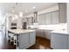 Stylish kitchen with stainless steel appliances, gray cabinets, white countertops, and hardwood flooring at 341 Little Pine Ln, Woodstock, GA 30188