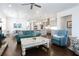 Open-concept living area with stylish furniture, hardwood flooring, and seamless flow to kitchen at 341 Little Pine Ln, Woodstock, GA 30188