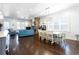 Spacious living room with hardwood floors, stone fireplace, ample seating, and natural light at 341 Little Pine Ln, Woodstock, GA 30188